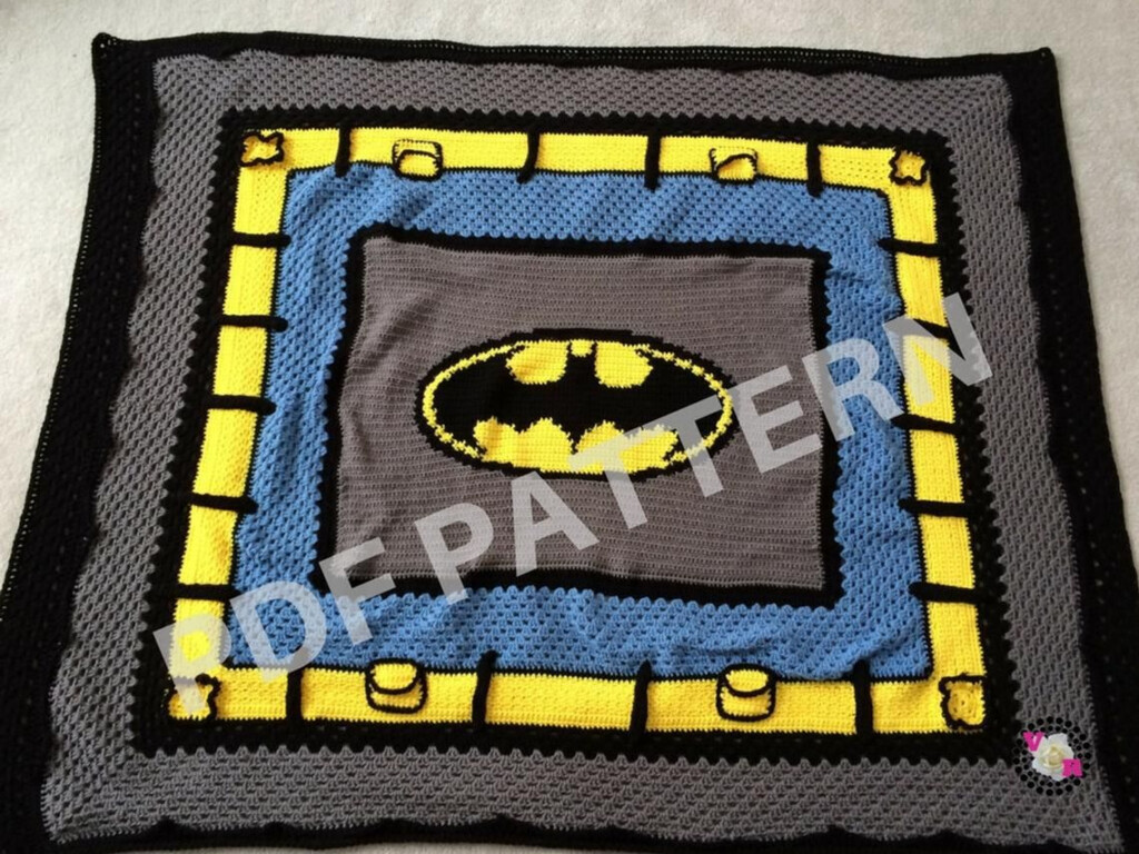 Batman Crochet Blanket Pattern A Crocheted Sitting On Top Of Bed Next 
